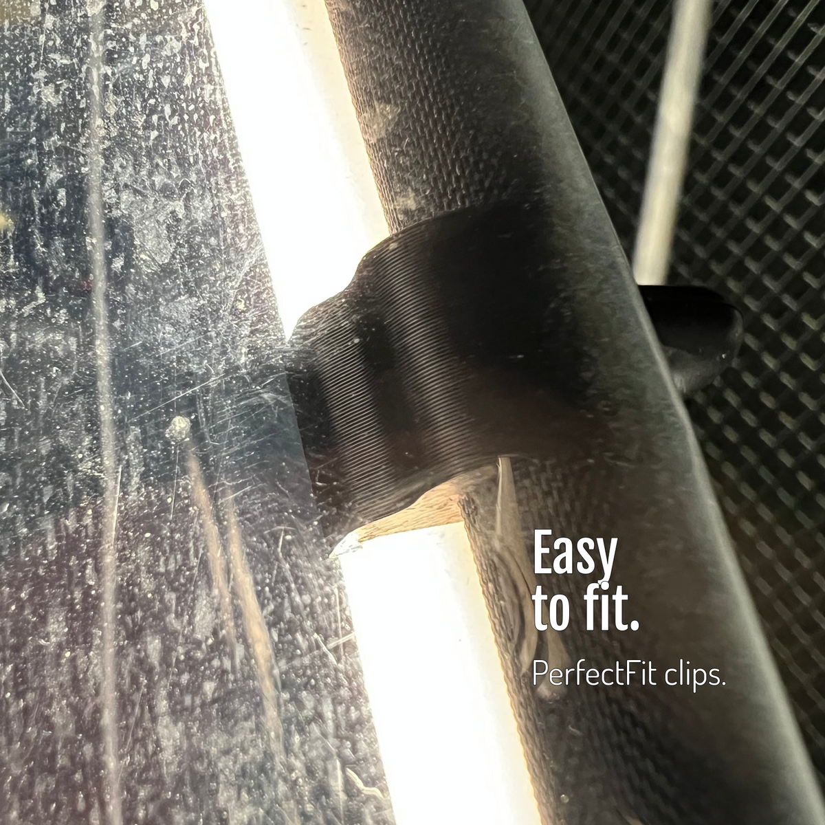 [en] Close-up of the CargoGLOW mount on the canopy frame beside the light strip. Quick to fit inside your canopy with matching PerfectFit clips.